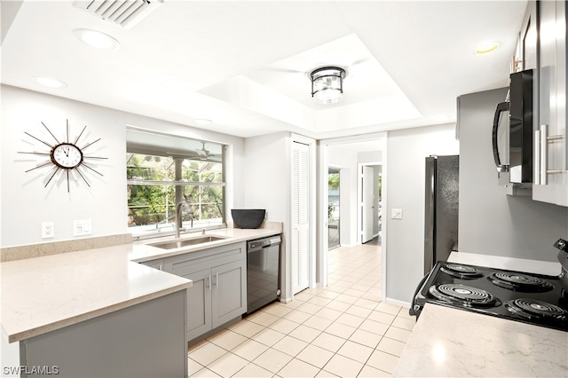 kitchen with light tile floors, sink, dishwasher, gray cabinets, and stove