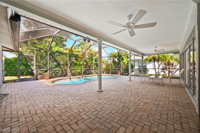 unfurnished sunroom with ceiling fan