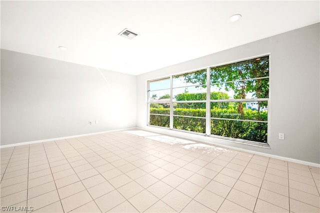 spare room featuring light tile floors