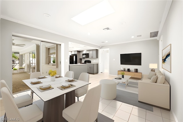 tiled dining area with ornamental molding, ceiling fan, and a skylight