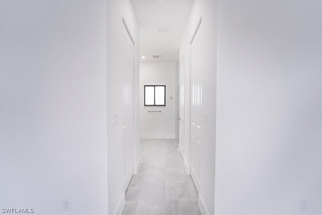 hallway with light tile floors