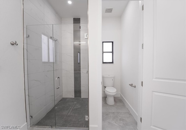 bathroom featuring an enclosed shower, tile flooring, and toilet