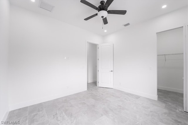 empty room featuring ceiling fan and light tile floors