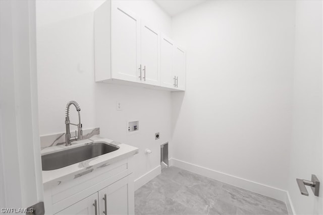 clothes washing area featuring cabinets, sink, light tile floors, electric dryer hookup, and washer hookup