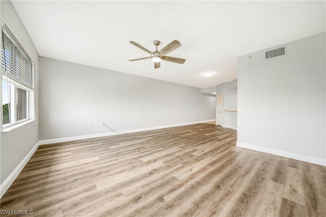 spare room featuring ceiling fan and light wood-type flooring