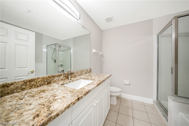 bathroom with toilet, tile flooring, walk in shower, and large vanity