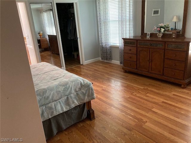 bedroom with light hardwood / wood-style flooring