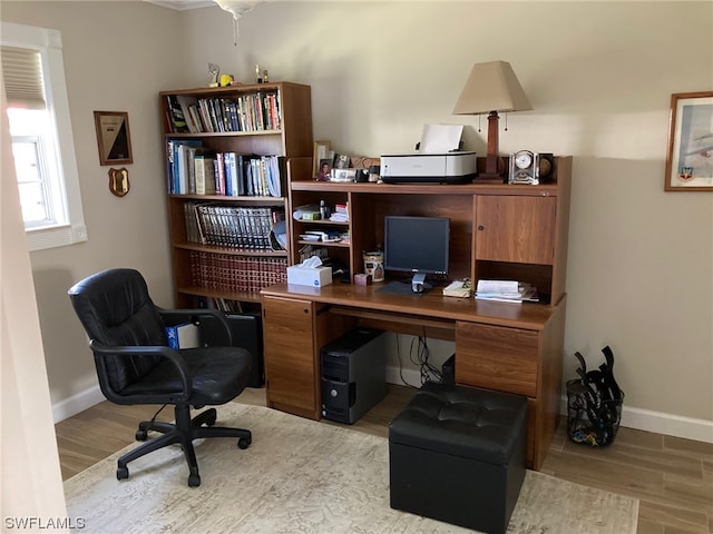 office space with light hardwood / wood-style flooring