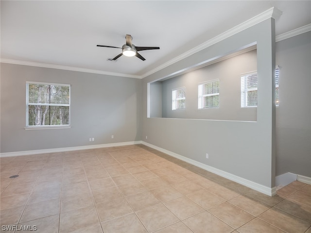 unfurnished room featuring crown molding, light tile patterned floors, and ceiling fan