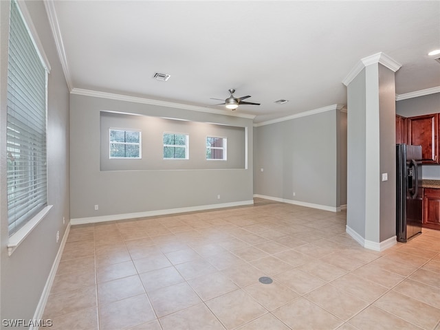 unfurnished room featuring light tile patterned floors and ornamental molding