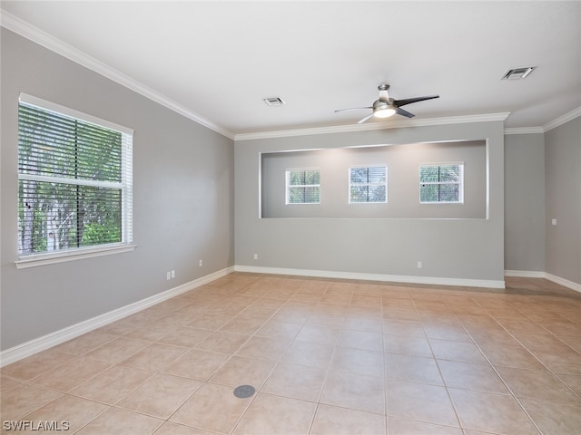 tiled empty room with crown molding, a healthy amount of sunlight, and ceiling fan