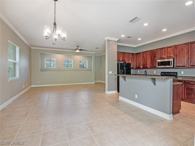 kitchen featuring light tile patterned flooring, a kitchen bar, a center island with sink, and black appliances