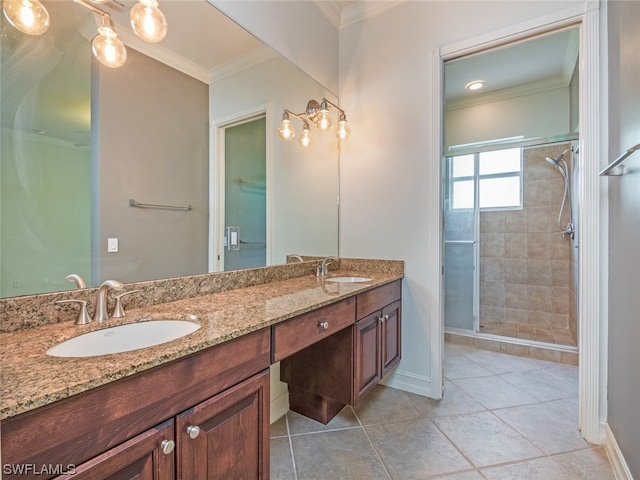 bathroom with vanity, an enclosed shower, crown molding, and tile patterned flooring