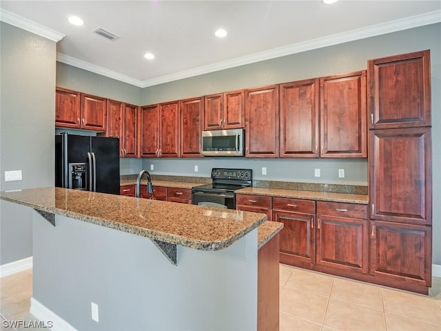 kitchen with light tile patterned flooring, a breakfast bar, ornamental molding, black appliances, and light stone countertops