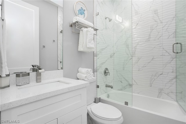 full bathroom featuring enclosed tub / shower combo, toilet, and large vanity