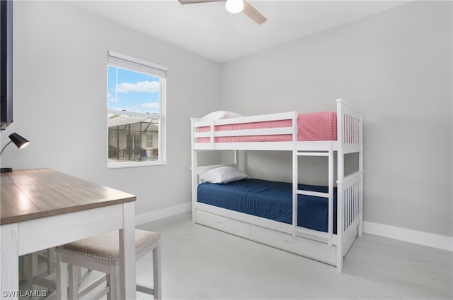 bedroom featuring ceiling fan and light tile floors