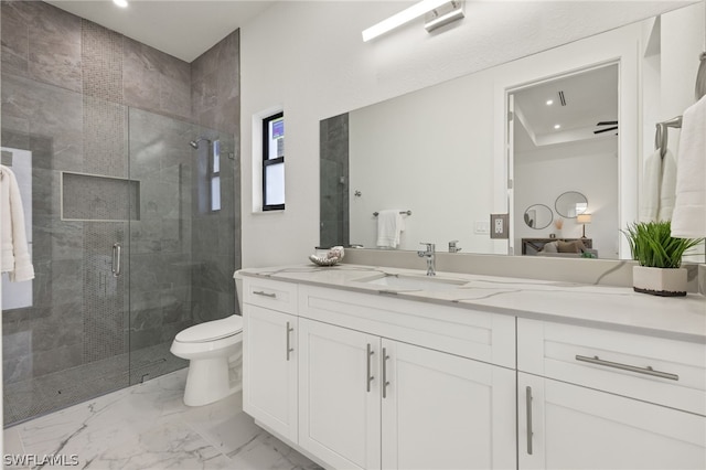 bathroom with tile flooring, vanity, an enclosed shower, and toilet