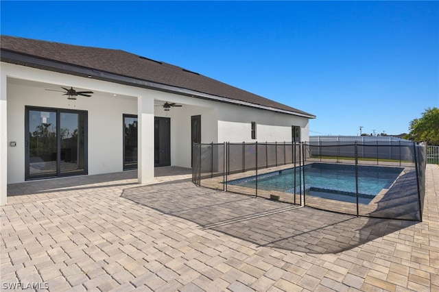 view of pool featuring ceiling fan and a patio area