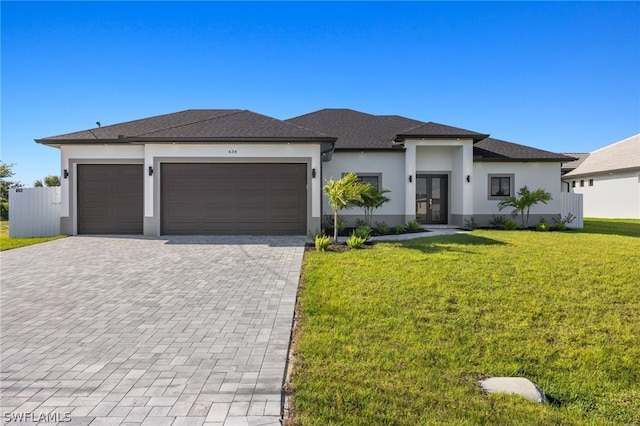 prairie-style house with a garage and a front yard