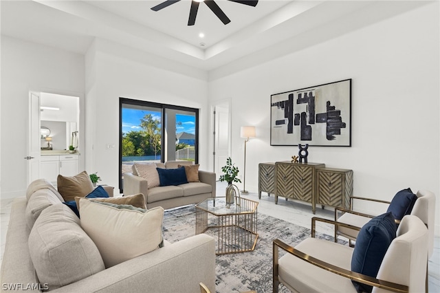 tiled living room featuring ceiling fan