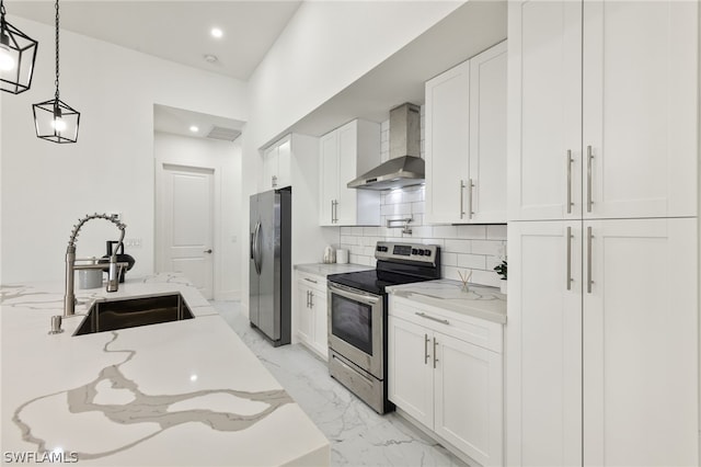 kitchen with white cabinets, sink, wall chimney range hood, tasteful backsplash, and stainless steel appliances