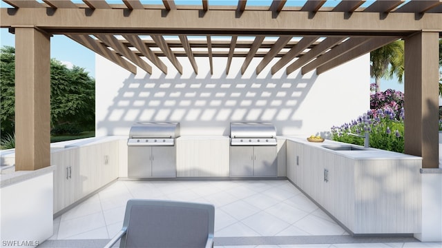 view of patio / terrace with area for grilling, sink, a pergola, and exterior kitchen