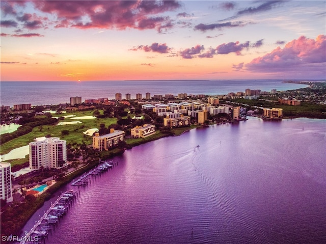 aerial view at dusk with a water view