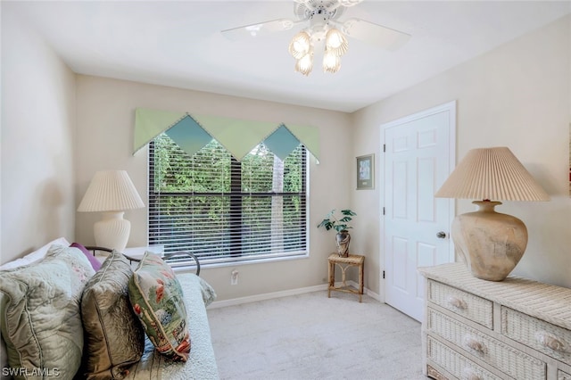 bedroom featuring ceiling fan and light carpet