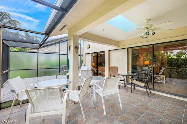 sunroom / solarium with ceiling fan