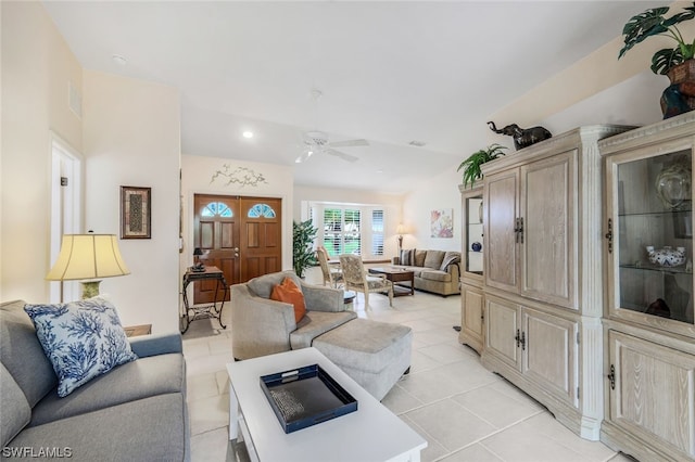 living room featuring ceiling fan and light tile patterned flooring