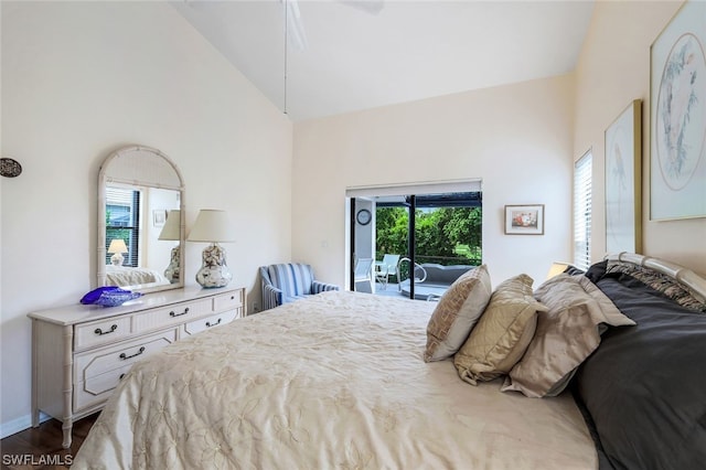 bedroom featuring hardwood / wood-style floors, access to outside, high vaulted ceiling, and ceiling fan