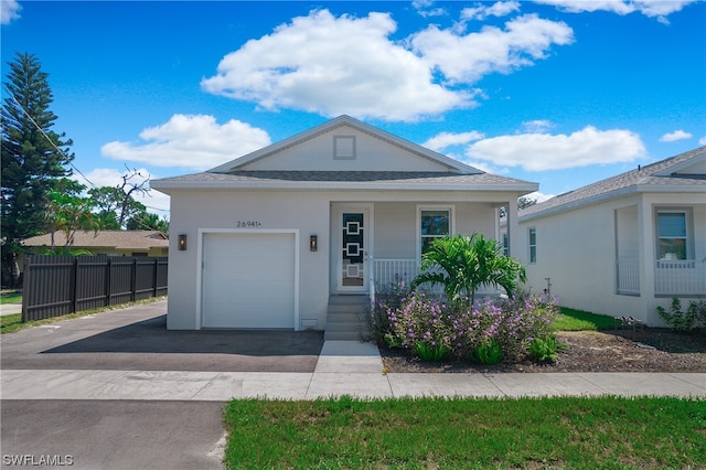 view of front of home with a porch and a garage