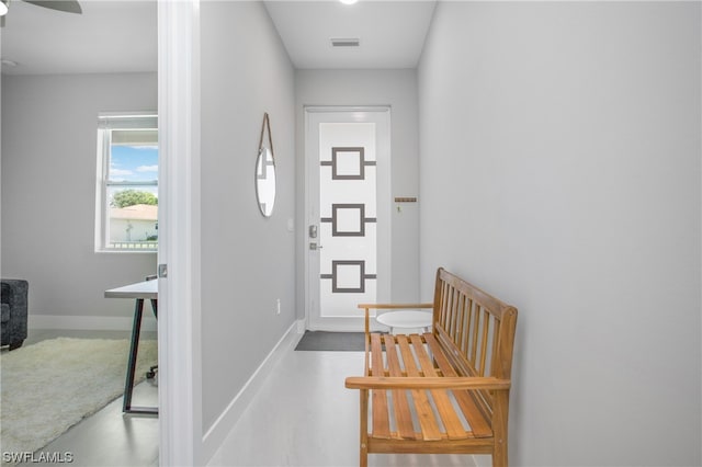 entrance foyer featuring ceiling fan