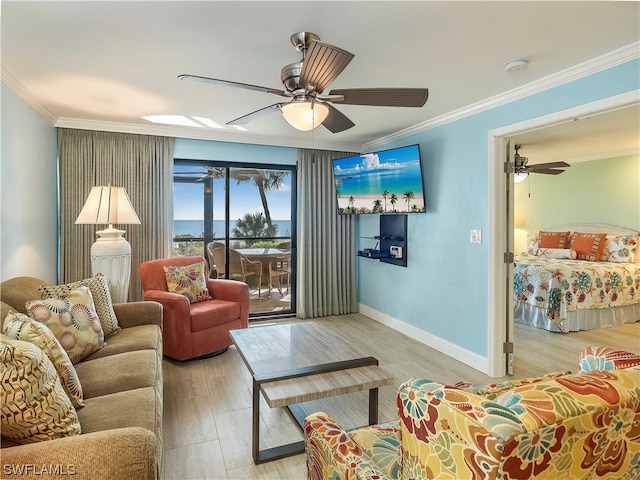 living room featuring ornamental molding, ceiling fan, and light hardwood / wood-style flooring