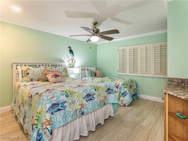 bedroom with ornamental molding, ceiling fan, and light wood-type flooring