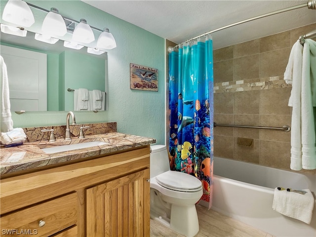 full bathroom featuring shower / bath combo, toilet, wood-type flooring, a textured ceiling, and vanity