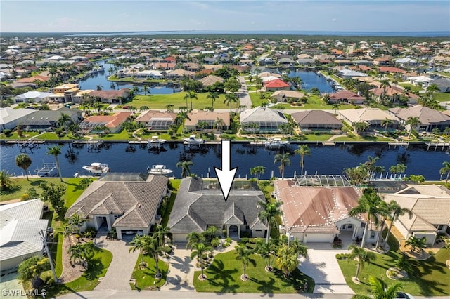 birds eye view of property featuring a water view