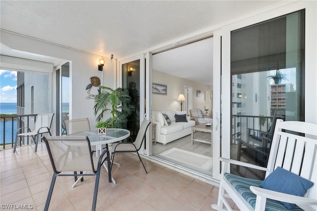7000 Estero Blvd Unit 403, Fort Myers Beach, FL 33931 - sunroom featuring a water view
