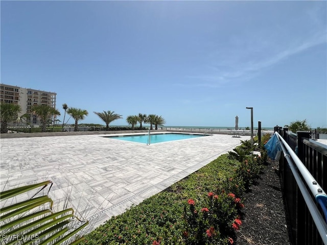 7000 Estero Blvd Unit 403, Fort Myers Beach, FL 33931 - community pool featuring a patio area and a water view