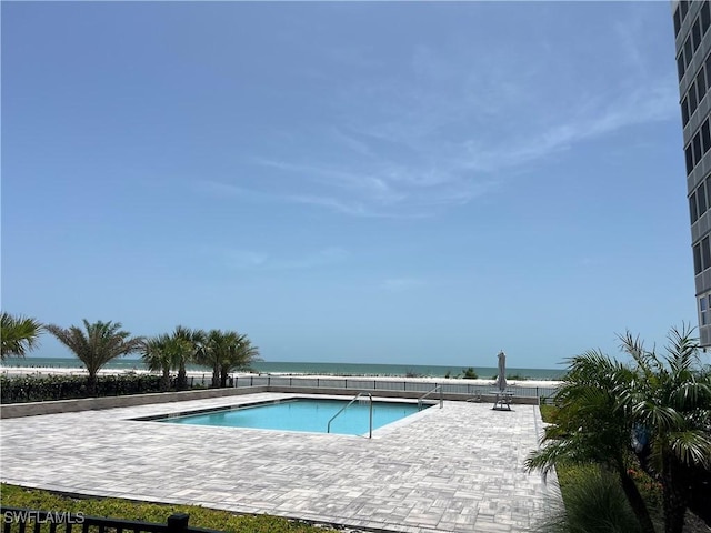 7000 Estero Blvd Unit 403, Fort Myers Beach, FL 33931 - community pool featuring a water view and a patio area