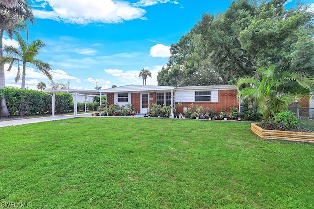 single story home featuring a front lawn and a carport