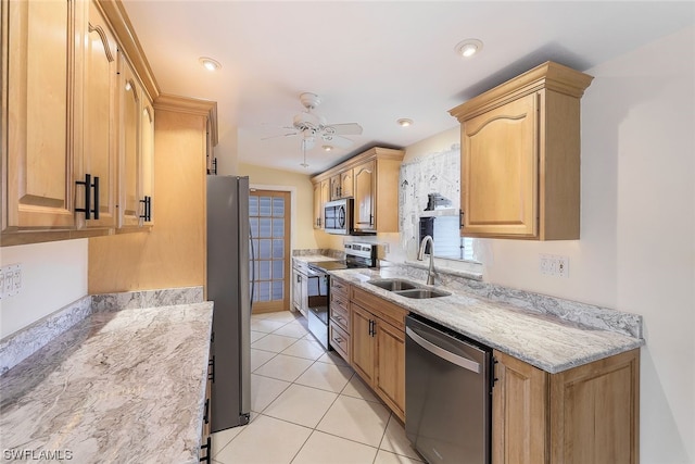 kitchen featuring sink, ceiling fan, light stone countertops, light tile patterned flooring, and stainless steel appliances