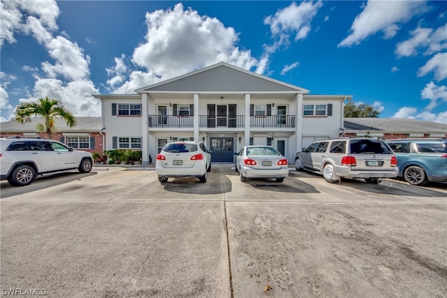 8741 Lueck Ln Unit 5, Fort Myers, FL 33919 - view of front facade featuring a balcony