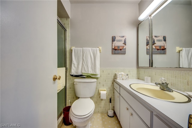 bathroom featuring tile walls, toilet, backsplash, tile flooring, and large vanity