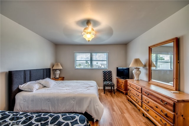 bedroom featuring ceiling fan and light hardwood / wood-style flooring