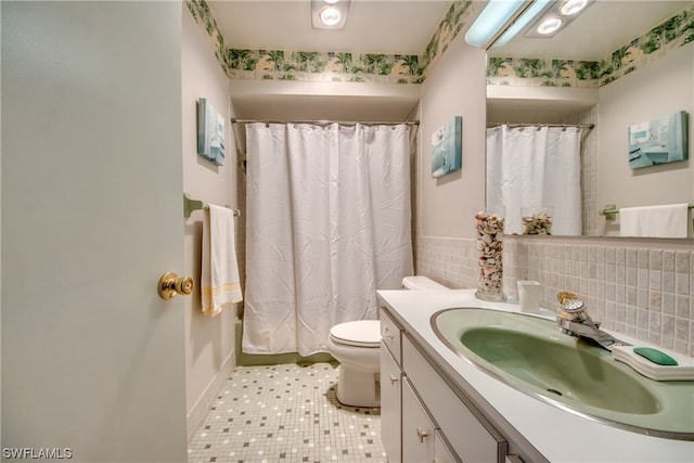 full bathroom featuring vanity, backsplash, tile flooring, toilet, and shower / bath combination with curtain