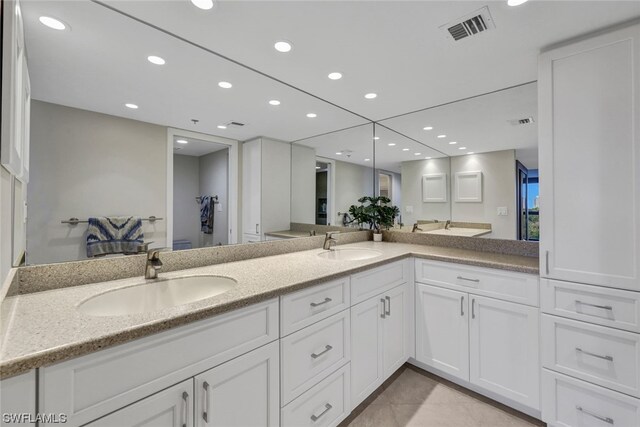 26235 Hickory Blvd Unit 4B, Bonita Springs, FL 34134 - bathroom with recessed lighting, double vanity, and tile patterned floors