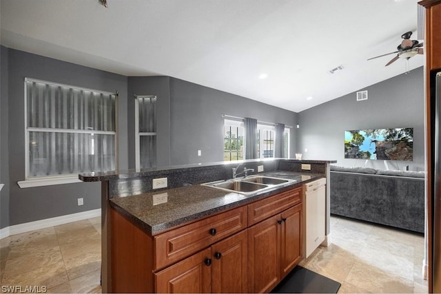 kitchen with lofted ceiling, ceiling fan, sink, and light tile flooring