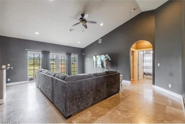 tiled living room with high vaulted ceiling and ceiling fan