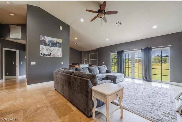 tiled living room featuring vaulted ceiling, ceiling fan, and french doors